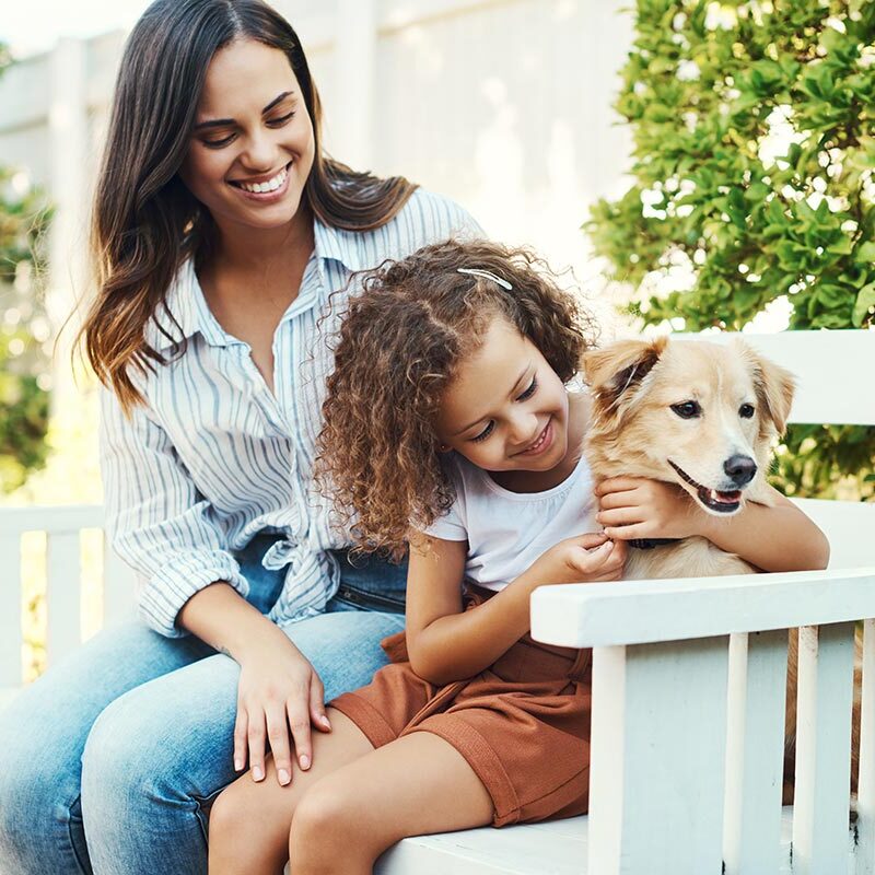 mother and daughter with their dog